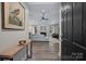 Inviting view into the living room with fireplace, ceiling fan, and open concept at 5179 Poplar Glen Dr, Matthews, NC 28104