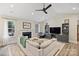 Cozy living room featuring a fireplace, vaulted ceiling, and modern decor at 5179 Poplar Glen Dr, Matthews, NC 28104