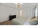 Comfortable main bedroom with decorative ceiling and a dark wood dresser at 5179 Poplar Glen Dr, Matthews, NC 28104