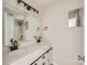 Bathroom featuring double sink vanity, modern lighting, and decorative hardware at 5817 Rocky Mount Ct, Charlotte, NC 28214