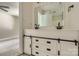 Modern bathroom features double sinks, a large mirror, and stylish vanity storage at 5817 Rocky Mount Ct, Charlotte, NC 28214