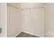 Empty walk in closet with wire shelving and neutral carpet at 5817 Rocky Mount Ct, Charlotte, NC 28214