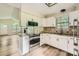 Open kitchen with granite countertops, stainless appliances, and hardwood floors at 5817 Rocky Mount Ct, Charlotte, NC 28214