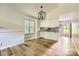 Cozy kitchen area featuring white cabinetry, granite countertops, and a modern light fixture at 5817 Rocky Mount Ct, Charlotte, NC 28214