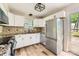 Bright kitchen with white cabinets, stainless steel appliances, and new countertops at 5817 Rocky Mount Ct, Charlotte, NC 28214