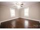 Comfortable bedroom with hardwood floors and a ceiling fan offers a serene retreat at 601 N Johnson St, Monroe, NC 28112