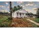 Quaint home with a covered front porch and freshly painted white exterior, nestled in a quiet setting at 601 N Johnson St, Monroe, NC 28112