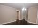 Open living space showcases hardwood floors, neutral paint, and detailed trim with great natural light at 601 N Johnson St, Monroe, NC 28112