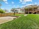 Beautiful backyard featuring a basketball court, spacious lawn, and a wooden deck at 612 Ideal Way, Charlotte, NC 28203