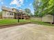 Expansive backyard with a basketball court, utility shed, and a covered deck, ideal for Gathering gatherings at 612 Ideal Way, Charlotte, NC 28203