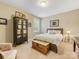 Bedroom featuring neutral walls, carpet, a bed with decorative pillows and a blanket, plus a wooden chest at 612 Ideal Way, Charlotte, NC 28203