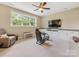 Carpeted bonus room with a large window, ceiling fan, game chair, and built-in storage at 612 Ideal Way, Charlotte, NC 28203