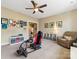 Bonus room featuring neutral walls, carpet, ceiling fan, game chair, and a built-in bookshelf at 612 Ideal Way, Charlotte, NC 28203