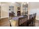 Elegant dining room showcasing a large wooden table, chandelier, and views of other living spaces at 612 Ideal Way, Charlotte, NC 28203