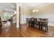 Spacious dining area features hardwood floors and stylish wainscoting, perfect for Gathering gatherings at 612 Ideal Way, Charlotte, NC 28203