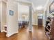 Open entryway with hardwood floors and elegant wainscoting leading into the dining and living areas at 612 Ideal Way, Charlotte, NC 28203