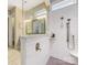 Modern walk-in shower with gray tiled flooring and white subway tiled walls, and a glass panel enclosure at 612 Ideal Way, Charlotte, NC 28203