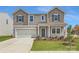 Charming two-story home with gray siding, a two-car garage, and well-manicured front yard at 6331 Fairfax Ct, Maiden, NC 28650