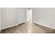 Bedroom with neutral paint, base trim, laminate flooring and an open closet at 6340 Green Vista Ct, Charlotte, NC 28212