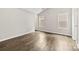 Roomy bedroom has neutral walls, durable wood-look flooring and nice natural light at 6340 Green Vista Ct, Charlotte, NC 28212