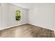 Bedroom with neutral paint, laminate flooring and a large window with green views at 6340 Green Vista Ct, Charlotte, NC 28212