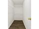 This closet features sturdy shelving and attractive wood-look laminate flooring at 6340 Green Vista Ct, Charlotte, NC 28212