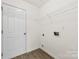 Simple laundry room with ample wall space and connection for a washer and dryer at 6340 Green Vista Ct, Charlotte, NC 28212