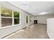Bright and open room features wood floors, a cozy fireplace, and large windows, perfect for relaxation at 6340 Green Vista Ct, Charlotte, NC 28212
