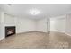 Empty living room features a fireplace and sleek wood floors, offering versatile design possibilities at 6340 Green Vista Ct, Charlotte, NC 28212