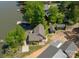 Beautiful aerial view showcasing the home's desirable lakefront location and private docks at 639 Panther Point Trl, Richfield, NC 28137