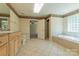 Bright bathroom features a large soaking tub, double sink vanity, and a separate shower at 639 Panther Point Trl, Richfield, NC 28137