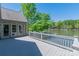 Outdoor deck showcasing serene waterfront views, perfect for relaxing and enjoying nature's beauty at 639 Panther Point Trl, Richfield, NC 28137