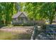 Lakeside home with a private dock, deck and lush greenery, offering a serene waterfront lifestyle at 639 Panther Point Trl, Richfield, NC 28137