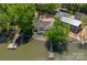 Charming lakefront home with a private dock, screened in porch and mature trees at 639 Panther Point Trl, Richfield, NC 28137