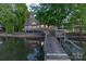 Charming lakefront home boasts a wooden dock and waterfront views, perfect for serene living at 639 Panther Point Trl, Richfield, NC 28137