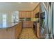 Modern kitchen with stainless steel appliances, ample cabinet space, and granite countertops at 639 Panther Point Trl, Richfield, NC 28137