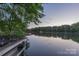Scenic waterfront view showcasing tranquil waters and lush greenery, perfect for nature lovers at 639 Panther Point Trl, Richfield, NC 28137