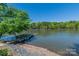 Scenic view of lake with mature trees at 639 Panther Point Trl, Richfield, NC 28137