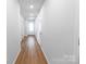 Bright hallway with wood-look flooring leading to a well-lit front door and rooms at 672 Lamorak Pl, Richburg, SC 29729