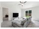 Inviting living room with a vaulted ceiling, a comfortable couch, and sliding glass doors to the backyard at 672 Lamorak Pl, Richburg, SC 29729
