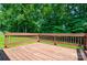 Well maintained deck offering an open-air space with view of lush green trees at 676 Rebecca Jane Dr, Mooresville, NC 28115