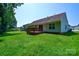 Spacious backyard featuring a deck, perfect for outdoor entertaining and relaxation at 676 Rebecca Jane Dr, Mooresville, NC 28115
