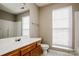 A functional bathroom features a single sink vanity and shower with a window at 676 Rebecca Jane Dr, Mooresville, NC 28115