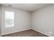 Cozy bedroom with a neutral color palette, carpet and bright natural light at 676 Rebecca Jane Dr, Mooresville, NC 28115