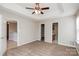 Generous main bedroom boasts tray ceiling, plush carpeting and access to en-suite at 676 Rebecca Jane Dr, Mooresville, NC 28115