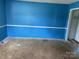 Empty bedroom with blue walls awaits your personal touch at 715 Sunridge Dr, Lincolnton, NC 28092