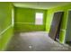 Spacious living room with green walls and natural light, awaiting personalization at 715 Sunridge Dr, Lincolnton, NC 28092