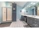 Bathroom featuring double sinks, shower, and tile flooring at 7430 Forney Hill Rd, Denver, NC 28037