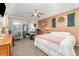 Comfortable bedroom featuring a ceiling fan, a door to the backyard and plenty of natural light at 7430 Forney Hill Rd, Denver, NC 28037