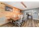 Spacious dining area with a wooden table, custom lighting, and stylish decor for gatherings at 7430 Forney Hill Rd, Denver, NC 28037